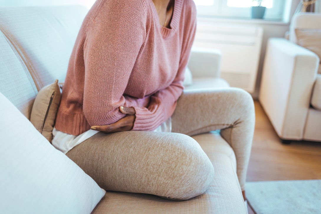 Woman clutching her stomach