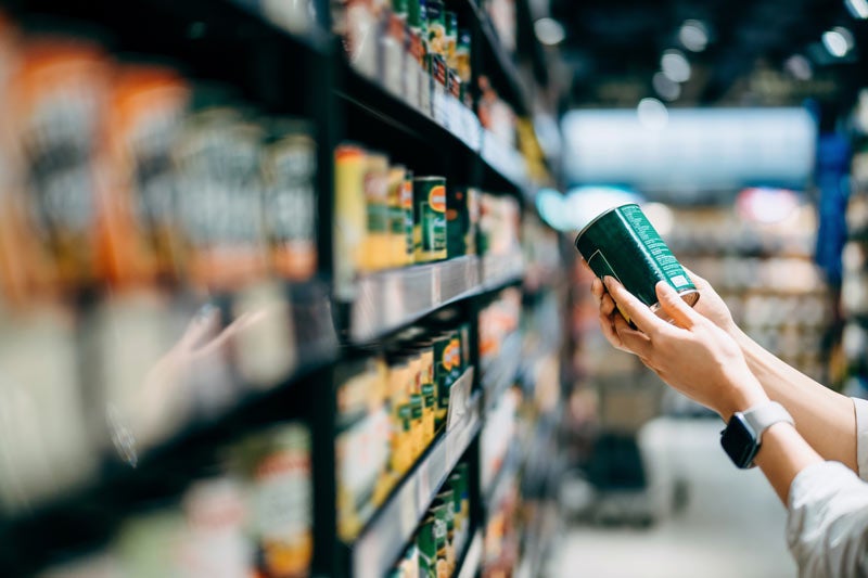 Looking at nutrition facts at grocery store