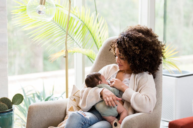 Mom breastfeeding newborn